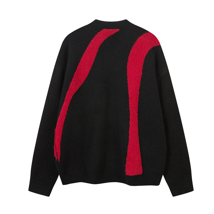 Back view of the black knit sweater featuring two long red curved stripes