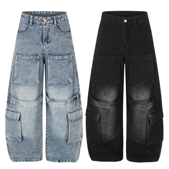 Front view of wide-leg cargo jeans in washed light blue and black denim with multiple utility pockets