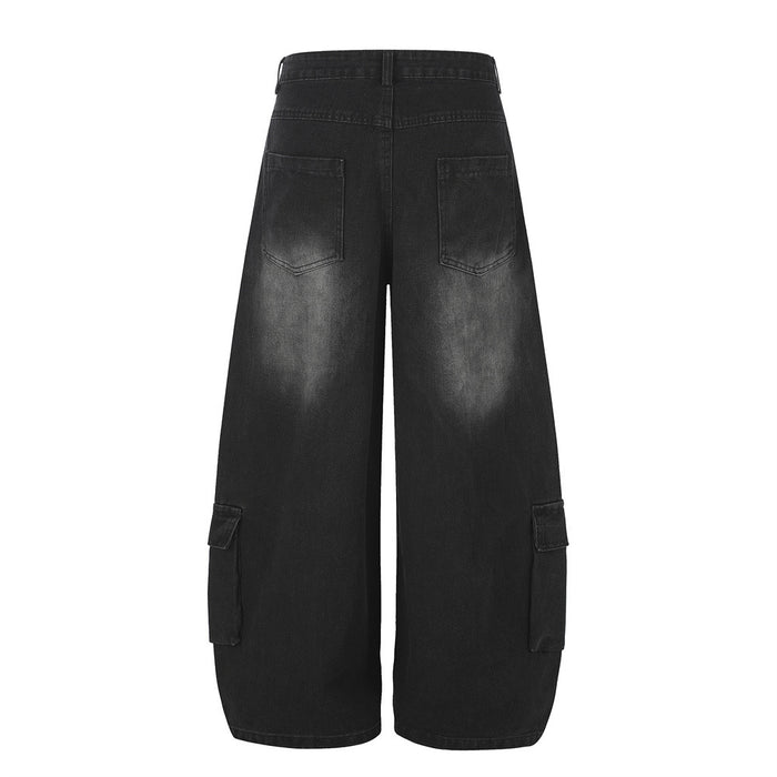 Back view of black wide-leg cargo jeans with two rear pockets and lower-leg cargo pockets