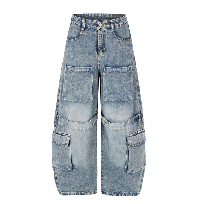 Front view of washed light blue wide-leg cargo jeans with large thigh and lower-leg pockets