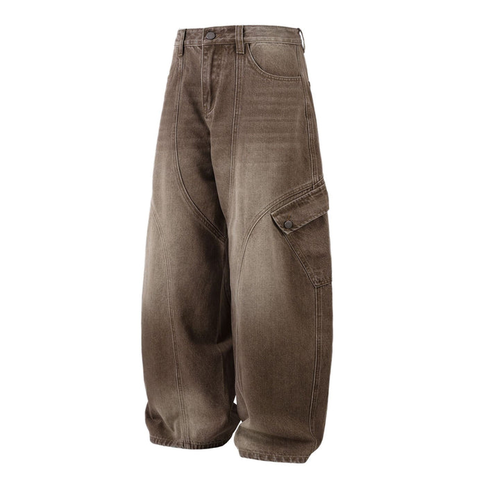 Angled front view of brown washed cargo jeans with a high waist, wide legs, and buttoned side pocket
