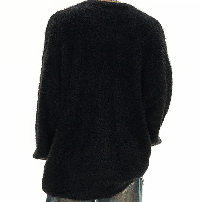 Back view of a black oversized fuzzy knit sweater worn on a model