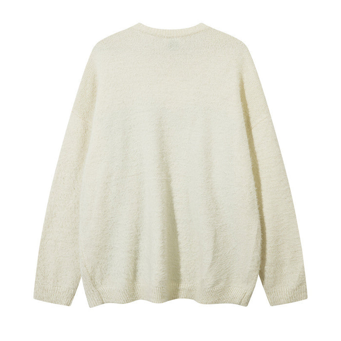 Plain cream oversized knit sweater shown flat from the back