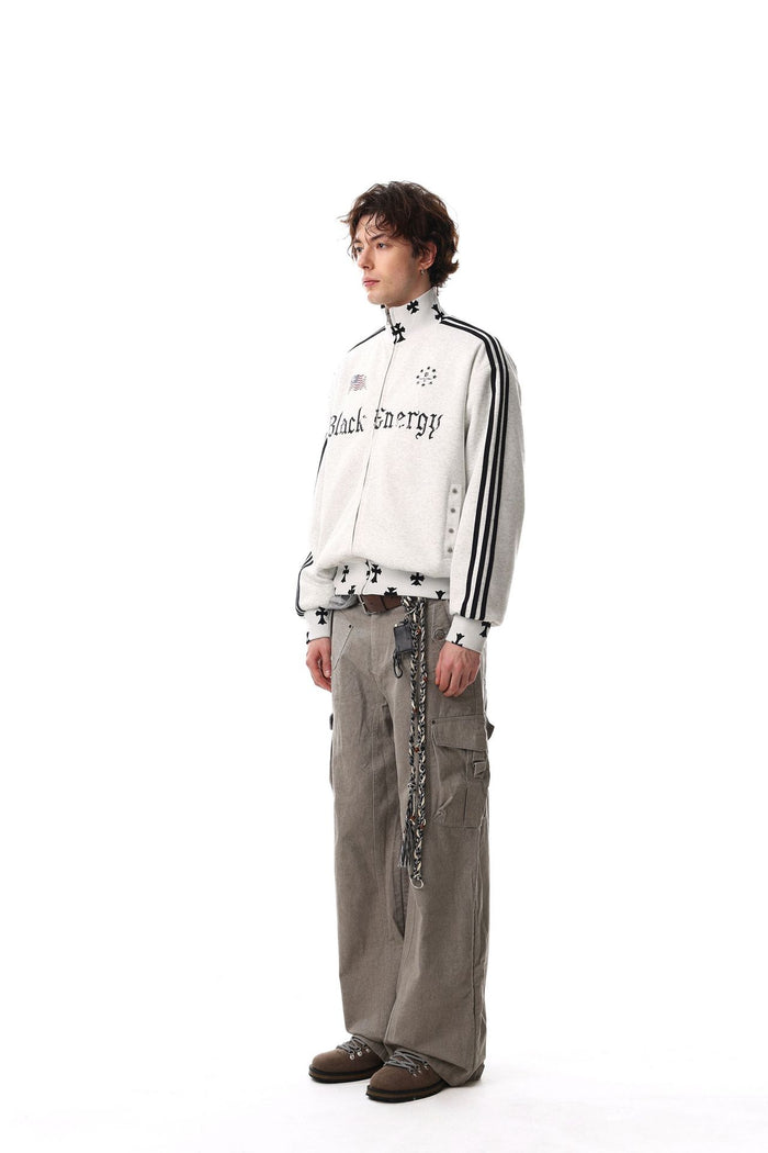 Side view of a model wearing the light gray striped full-zip track jacket