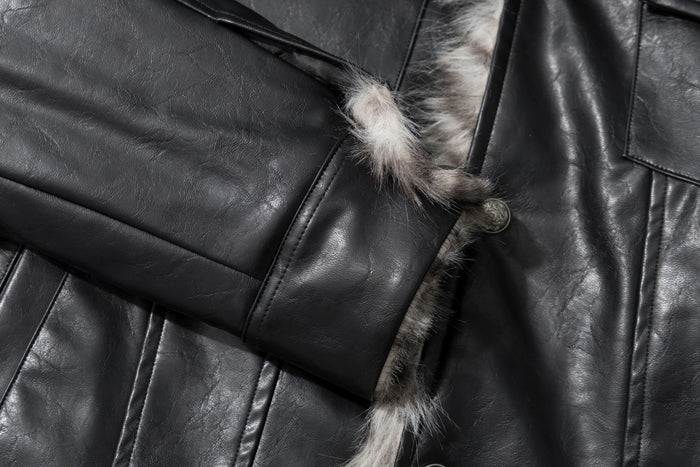 Close-up of a black faux leather sleeve cuff beside the fur-trimmed front opening and snap button