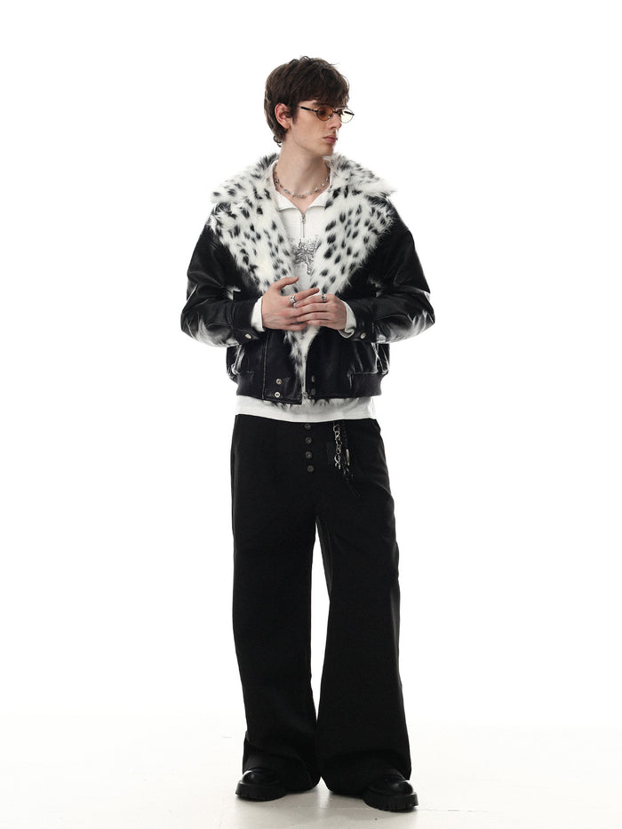 Full-length model view of a black faux leather bomber jacket with a spotted faux fur collar