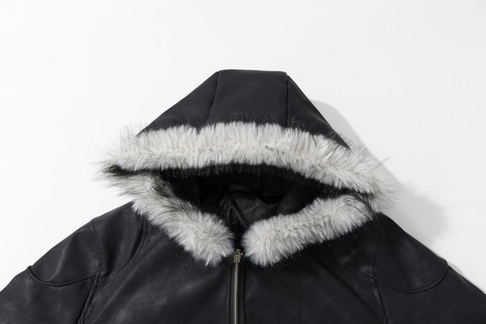 Close-up of the black jacket hood showing soft light faux fur trim, black lining, and front zipper