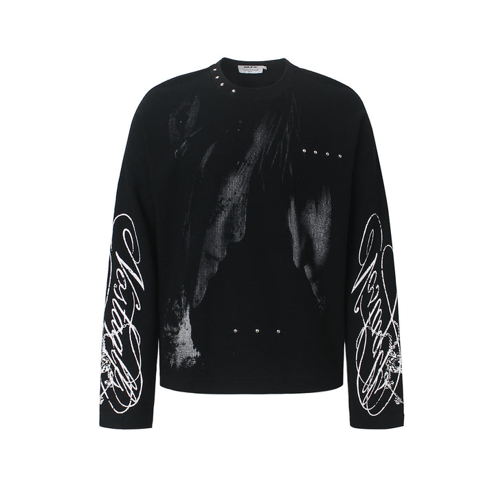 Black oversized long sleeve graphic tee with halftone portrait print, silver stud accents, and white script embroidery on sle