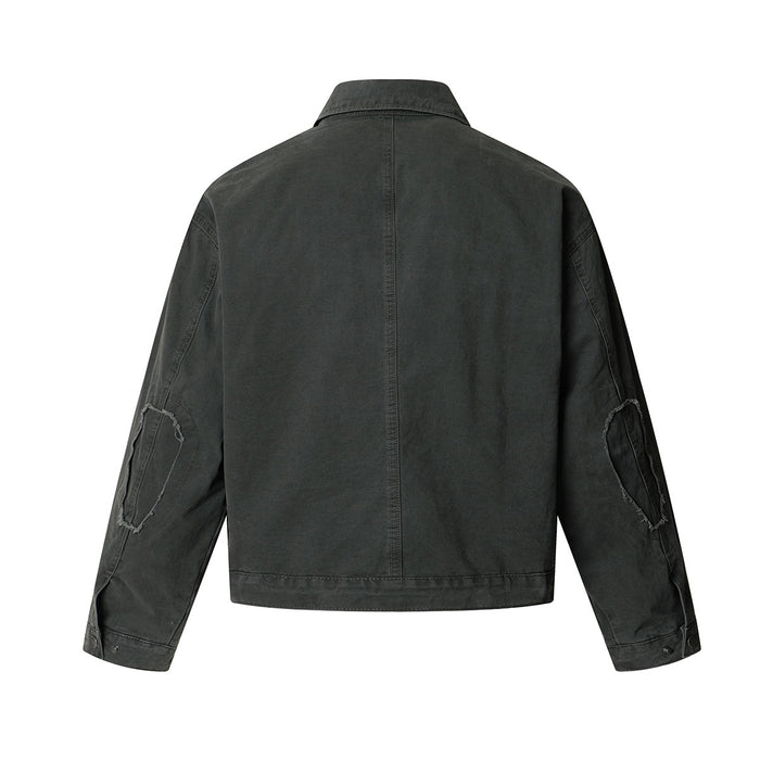 Back view of a dark army green washed Harrington jacket with distressed elbow patches and short boxy hem