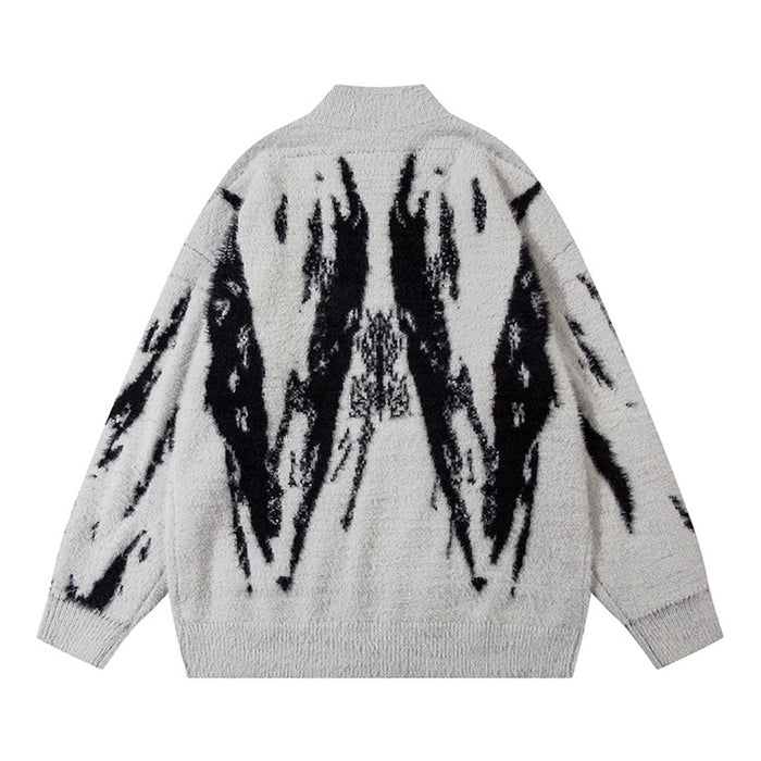 Light gray fuzzy knit cardigan shown from the back with a large symmetrical black abstract pattern