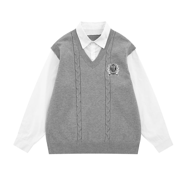 Front view of a gray cable-knit sweater vest layered over a white collared shirt with crest embroidery