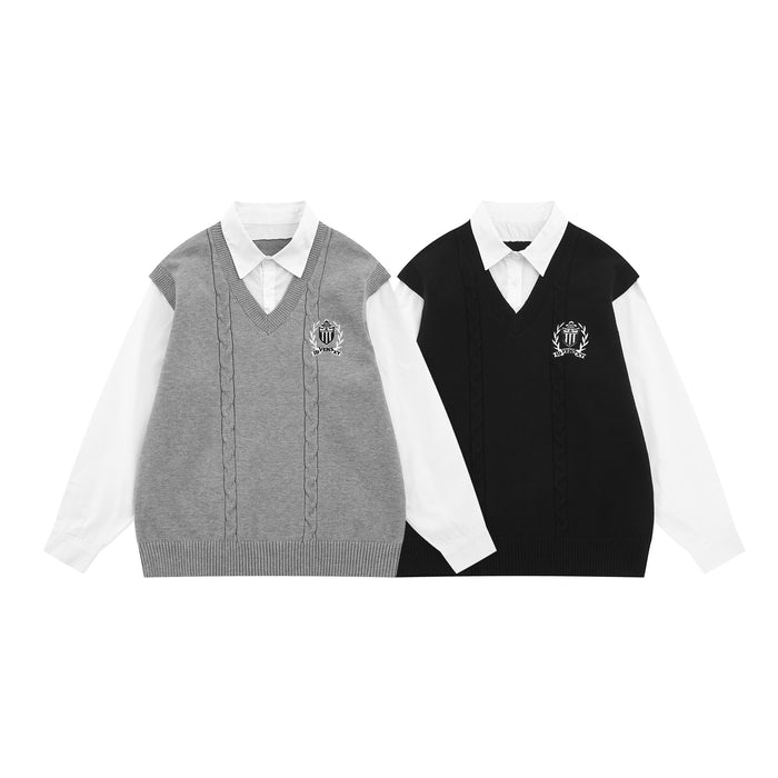 Front view of gray and black cable-knit sweater vests layered over white shirts with crest embroidery