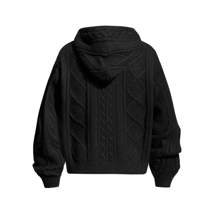 Black cable knit hoodie shown from the back with a draped hood, diamond panels and ribbed cuffs