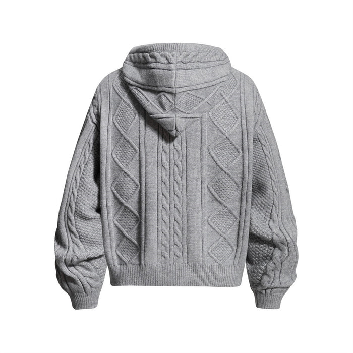 Gray cable knit hoodie shown from the back with a draped hood, diamond panels and ribbed cuffs