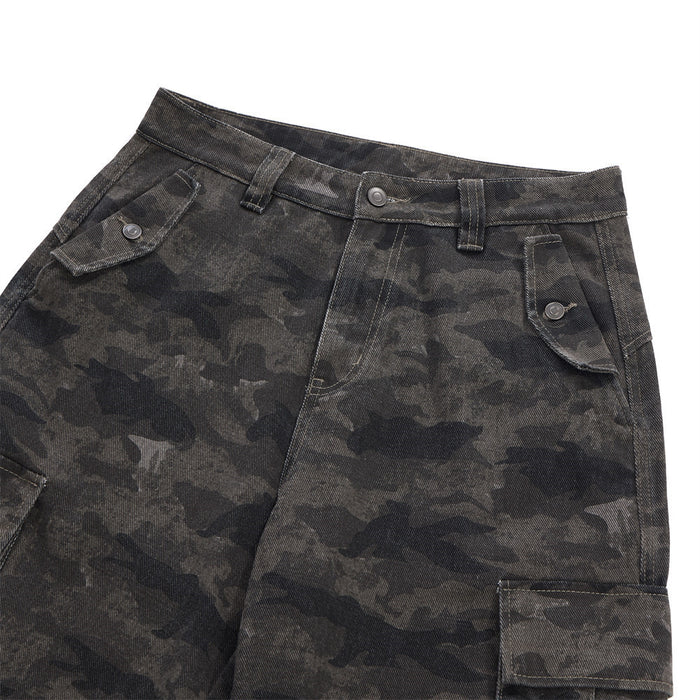 Close-up of the front waistband and upper pockets on dark gray camouflage cargo trousers