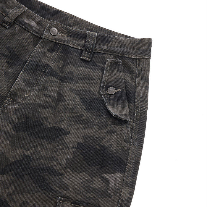 Close-up of a front angled pocket with buttoned flap on dark gray camouflage trousers
