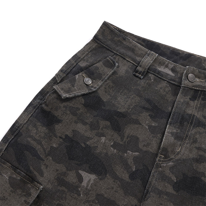 Close-up of the upper front trousers showing a buttoned pocket flap and dark camouflage pattern