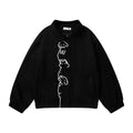 Oversized cartoon dog embroidery snap-button varsity bomber jacket in black, front view