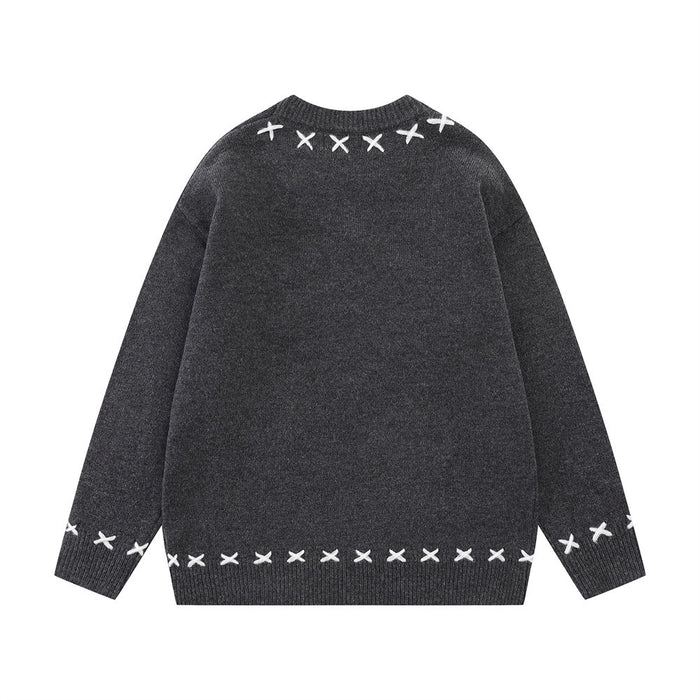 Charcoal gray knit crew neck sweater back with white X-shaped stitching at the collar, cuffs, and hem