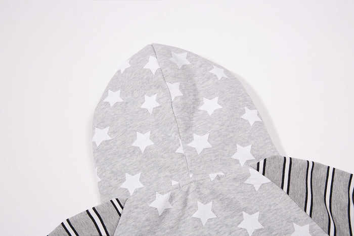 Close-up of the gray cat-ear hood with white star print and striped sleeve panel