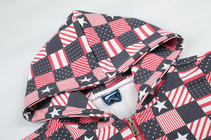 Close-up of the patterned hoodie showing the hood, collar, lining, and red front zipper