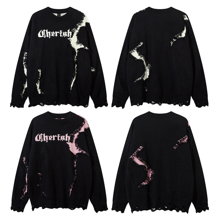 Oversized black distressed knit crewneck sweater with gothic Cherish lettering and star-shaped color-block panel in white and
