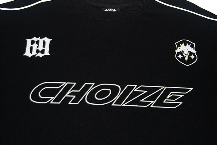 Black sweatshirt chest detail with outlined Choize lettering, white emblems, and contrasting shoulder piping