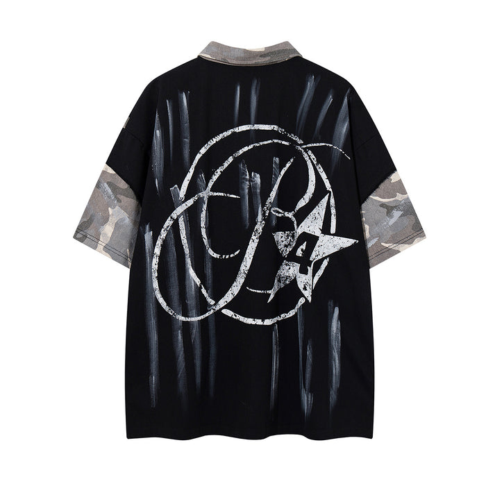 Back view of black short-sleeve polo shirt with gray camouflage sleeve panels and large white abstract graphic