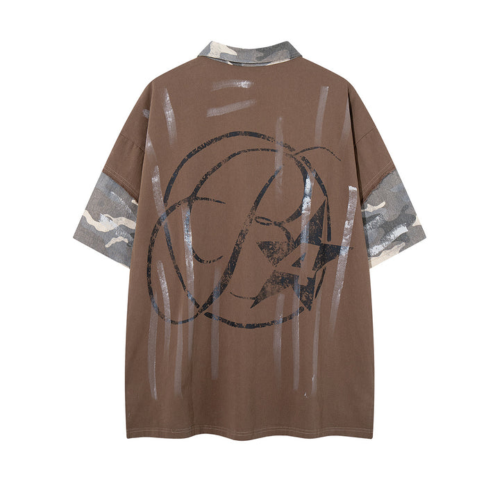 Back view of brown polo shirt with gray camouflage sleeve panels, vertical paint marks, and large dark abstract graphic