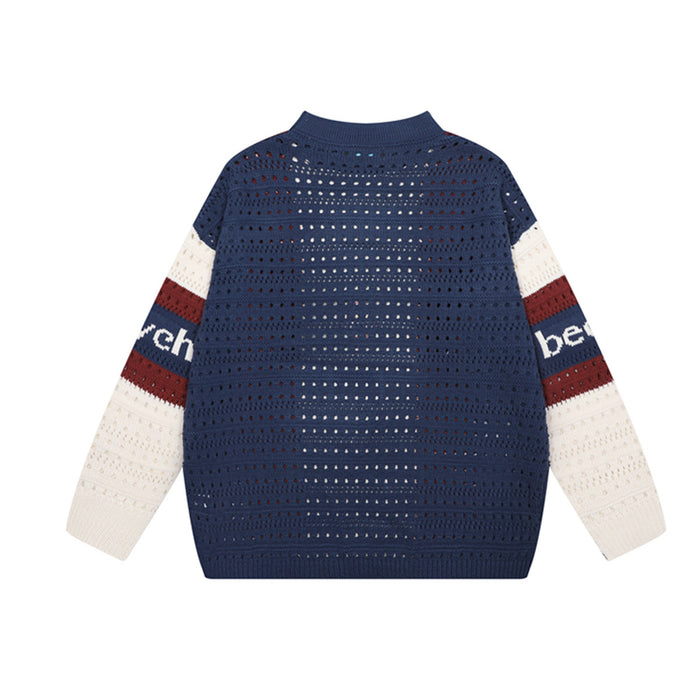 Back view of a navy open-knit sweater with burgundy and cream striped sleeves
