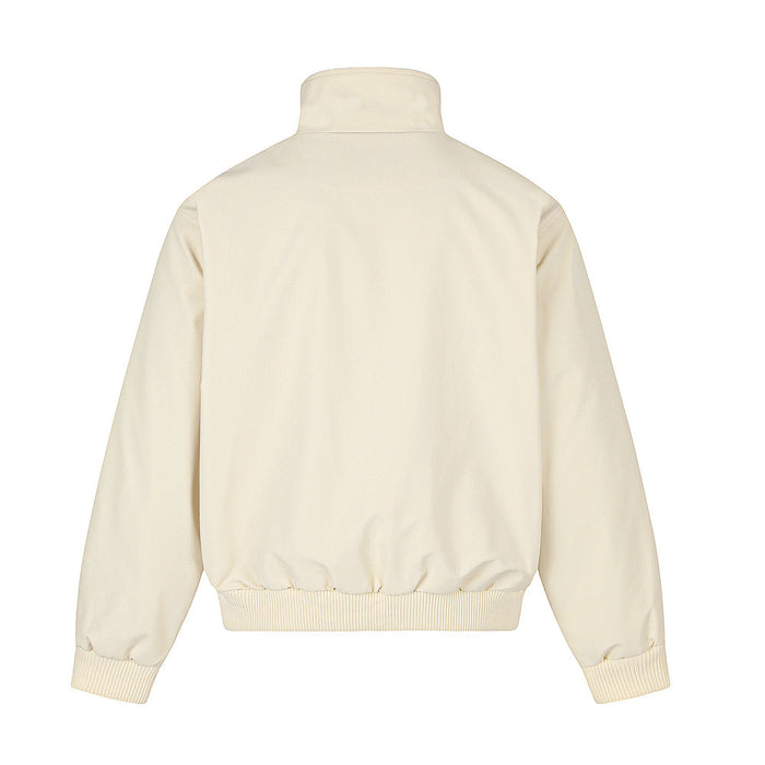 Back view of the cream stand-collar jacket with a plain body, elastic hem, and ribbed cuffs