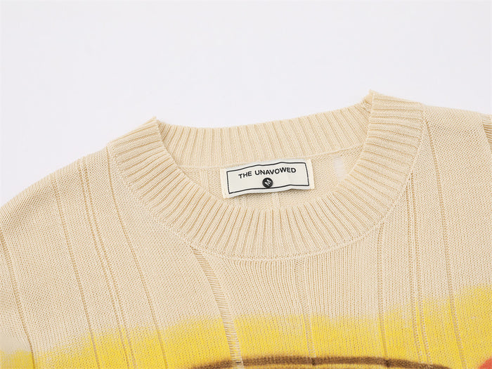 Close-up of a cream ribbed knit crew neckline with yellow stripe detail and sewn neck label