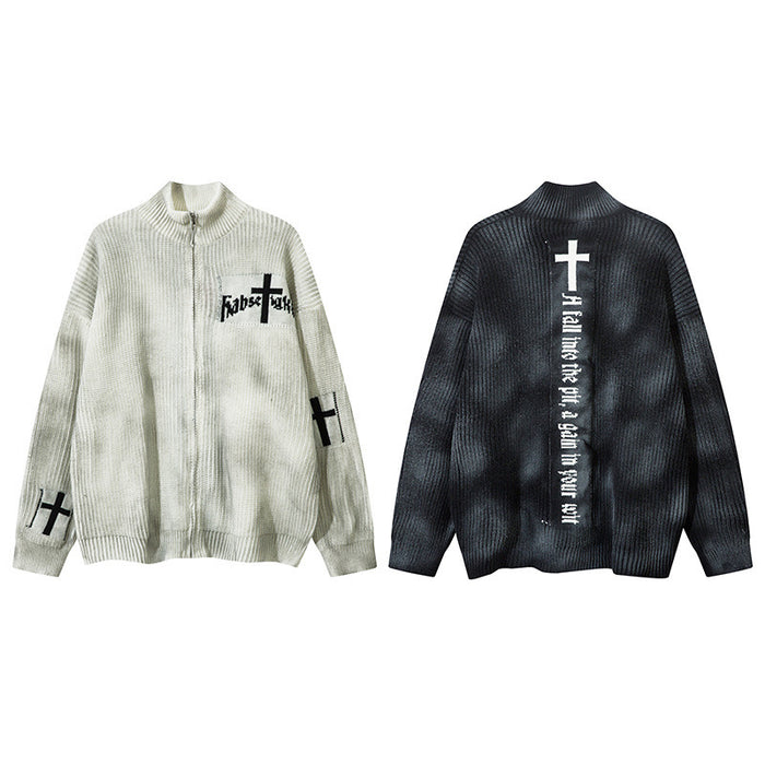 Cream front and black back views of a distressed rib-knit zip-up cardigan with cross graphics and text panels