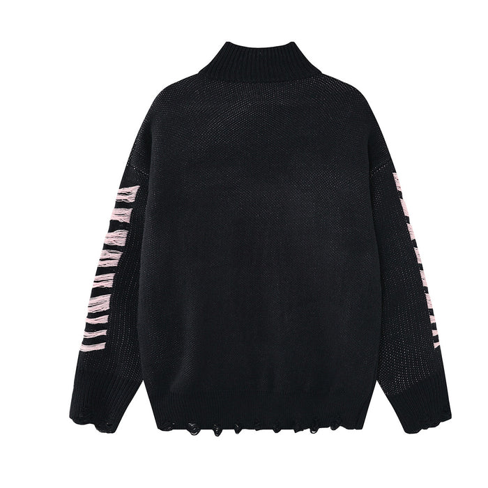 Back view of a black distressed knit turtleneck sweater with pale pink sleeve accents and a frayed hem