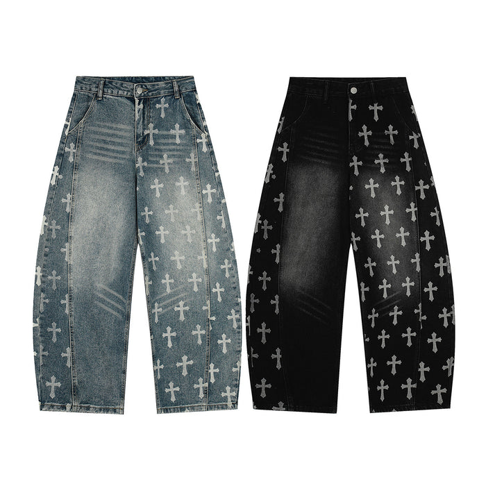 Front view of wide-leg washed denim jeans in blue and black with repeated light cross prints