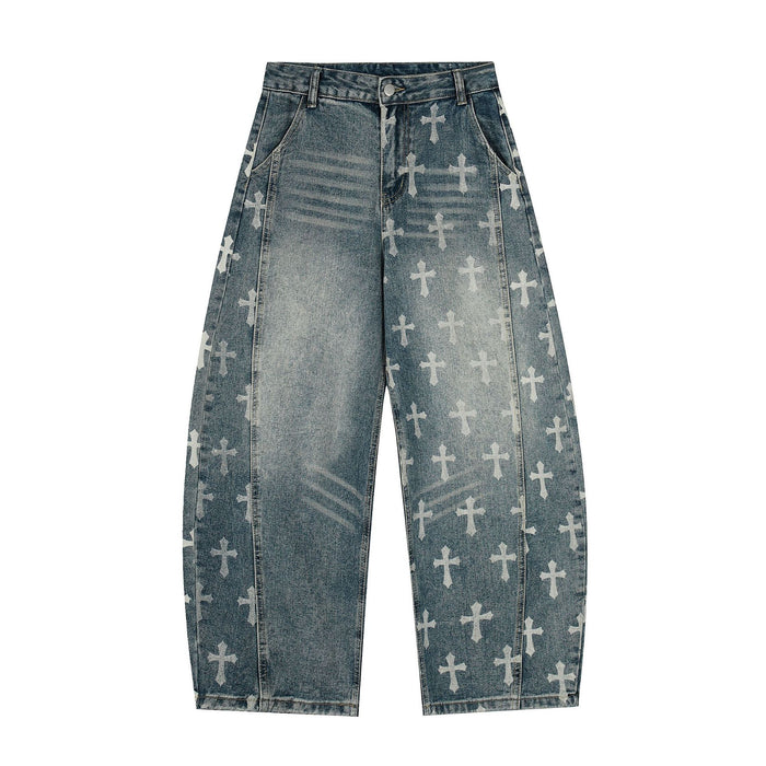 Baggy wide-leg jeans with all-over white gothic cross print on washed blue denim, front view