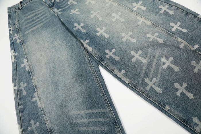 Close-up of blue washed denim legs showing light cross prints, fading, seams, and textured twill