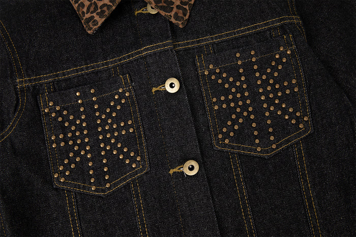 Close-up of the dark denim jacket front showing leopard print collar, gold buttons, and studded chest pockets
