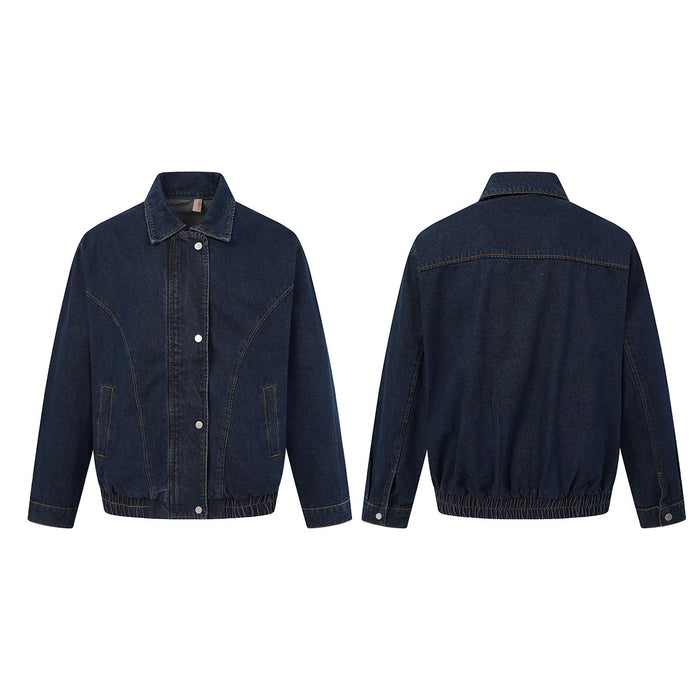 Dark indigo denim bomber jacket shown from the front and back with pointed collar, pockets and elastic hem