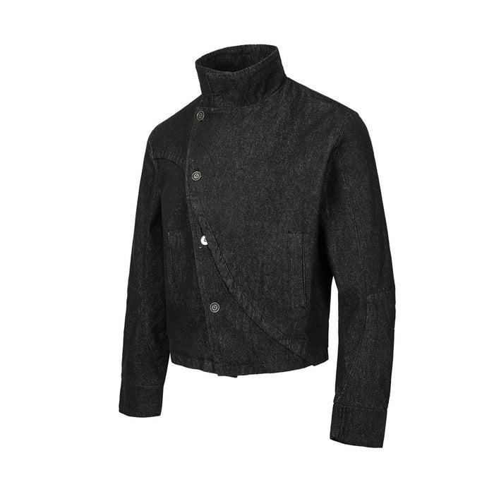 Angled front view of a black denim jacket with stand collar, asymmetric button closure and diagonal front panel