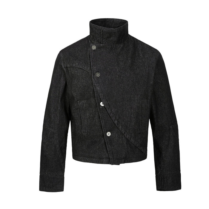 Front view of a black denim jacket showing the stand collar, offset buttons, diagonal closure and long sleeves