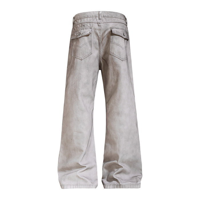 Light gray washed flare jeans shown from the back with flap-covered rear pockets and wide hems