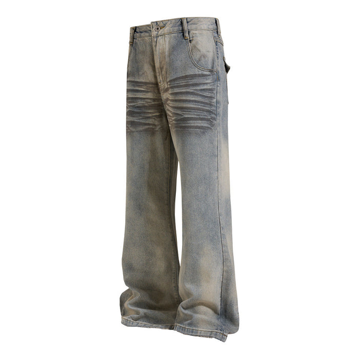 Washed blue flare jeans shown from a front three-quarter angle with curved pockets and wide legs