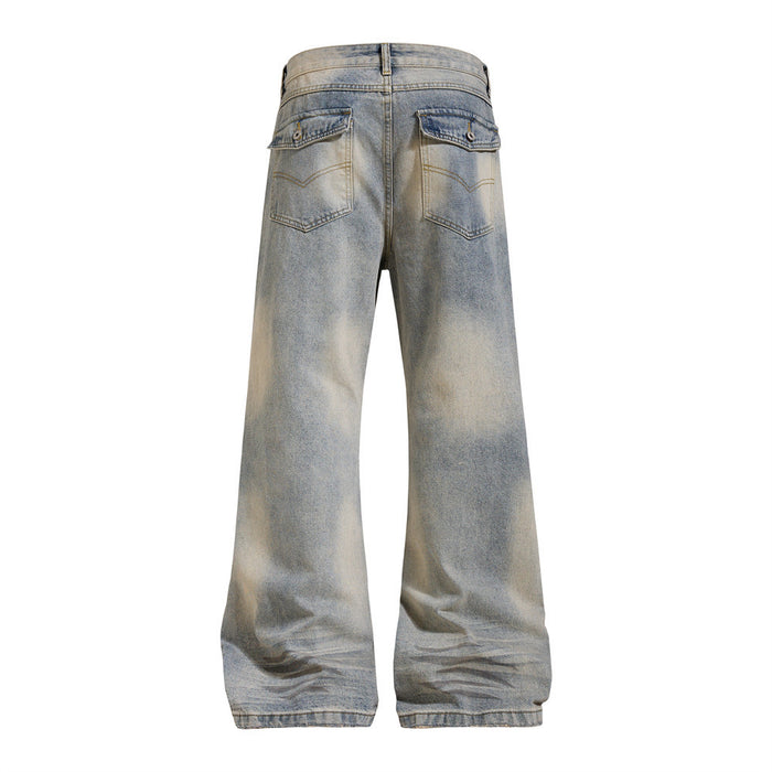 Washed blue wide-leg jeans shown from the back with flap-covered rear pockets and faded denim finish
