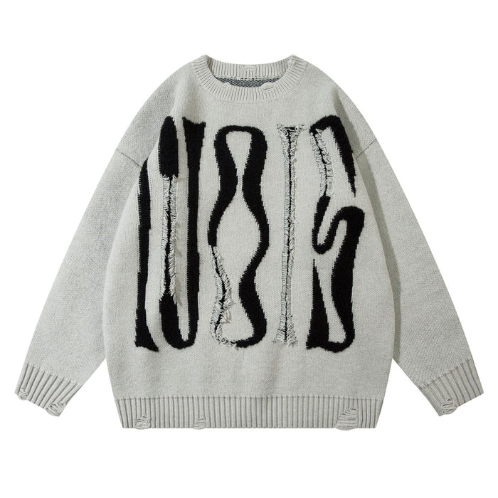Light gray oversized knit sweater front featuring large distressed black abstract lettering