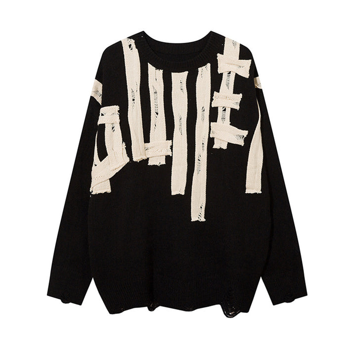 Black knit crewneck sweater front with distressed cream letter appliqués and frayed hem details