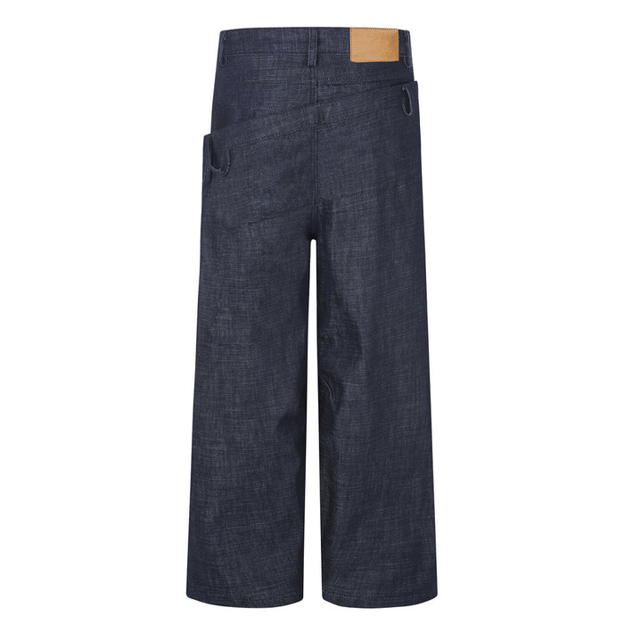 Back view of dark indigo wide-leg jeans with a layered waistband, belt loops, rear pocket panel, and tan leather patch