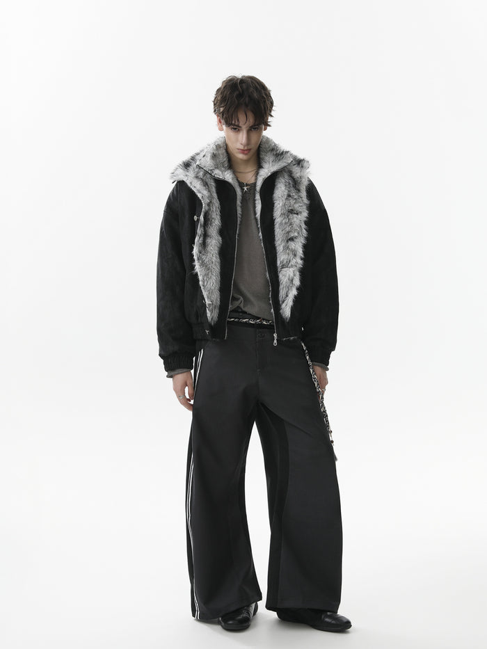Model wearing the black faux fur collar bomber jacket open, showing the contrasting gray fur lining