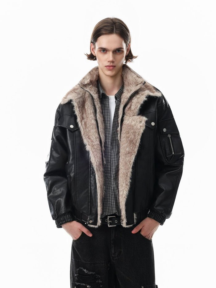 Model wearing an open black faux leather bomber jacket with a wide cream fur lining and sleeve pocket