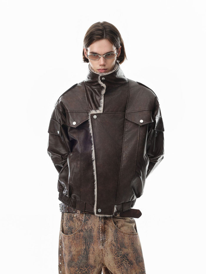 Model wearing a closed brown faux leather bomber jacket with a raised collar, flap pockets, and ribbed cuffs